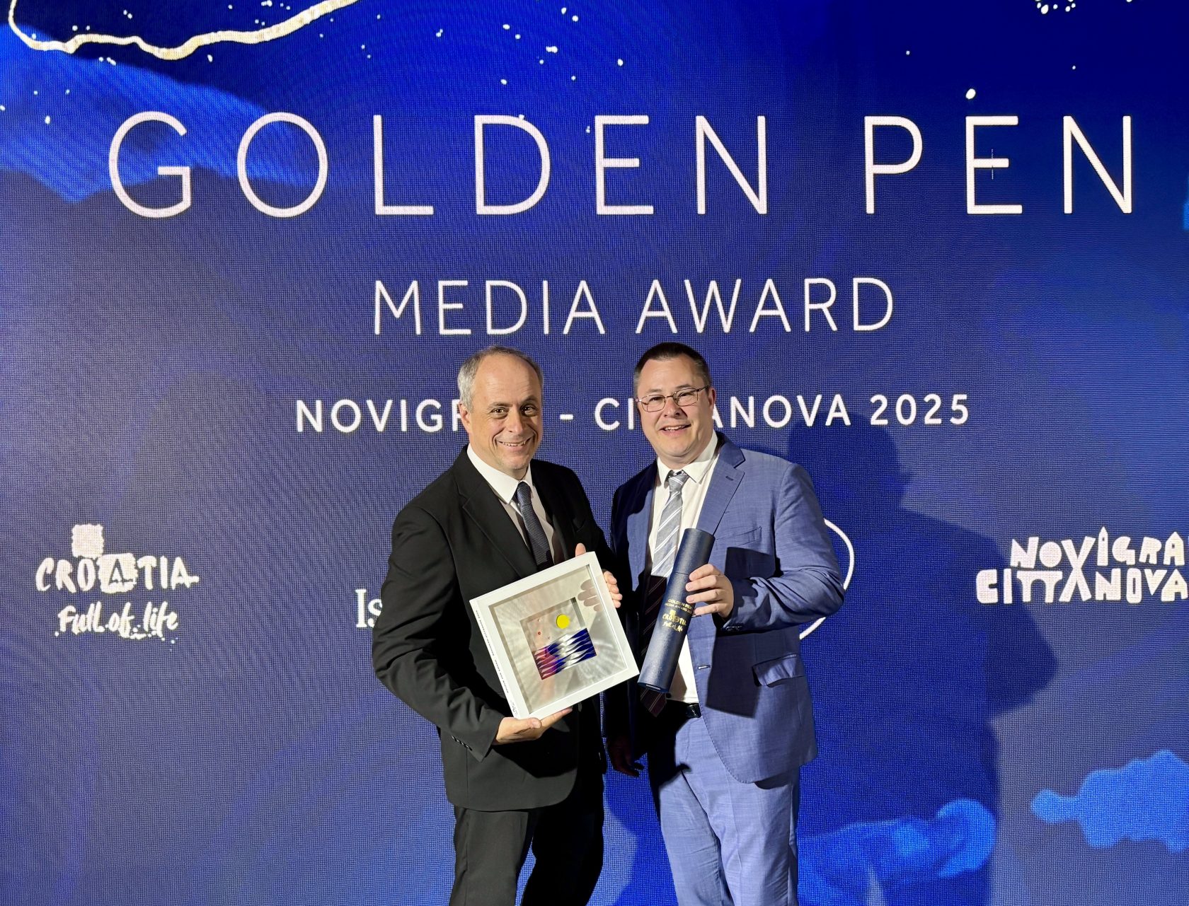 Georg Lux und Helmuth Weichselbraun mit der Auszeichnung des „Golden Pen Media Award“ 2025