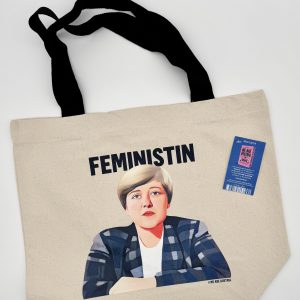 Foto der Stofftasche mit einer Illustration von Johanna Dohnal und der schwarzen Überschrift Feministin